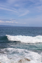 Suwehan beach on Nusa Penida Island, Bali, Indonesia. Amazing  view, white sand beach with rocky mountains and azure lagoon with clear water of Indian Ocean 