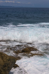 Suwehan beach on Nusa Penida Island, Bali, Indonesia. Amazing  view, white sand beach with rocky mountains and azure lagoon with clear water of Indian Ocean 