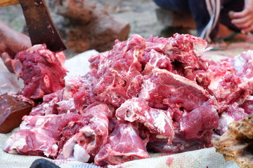 Fresh red beef is cut into small pieces to celebrate the Muslim holiday, Eid al-Adha