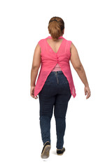 Fototapeta premium rear view of a woman walking on white background