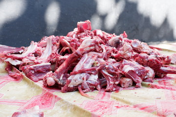 Fresh red beef is cut into small pieces to celebrate the Muslim holiday, Eid al-Adha