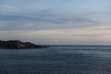 Sunset Over the Angel's Billabong beach on Nusa Penida Island, Bali, Indonesia. Amazing  view of Indian Ocean 