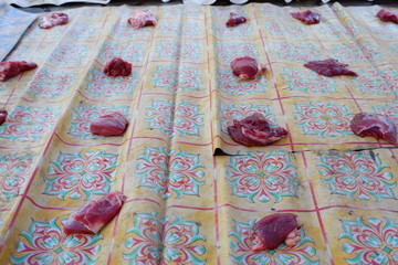 Fresh red beef is cut into small pieces to celebrate the Muslim holiday, Eid al-Adha