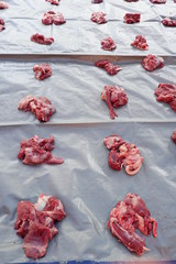 Fresh red beef is cut into small pieces to celebrate the Muslim holiday, Eid al-Adha