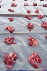 Fresh red beef is cut into small pieces to celebrate the Muslim holiday, Eid al-Adha