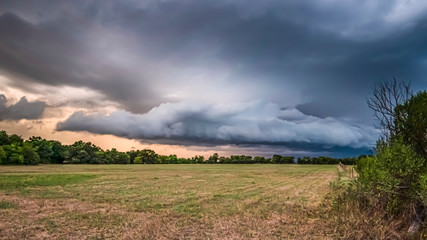 Evening storms over a hay field © Tim Barnes