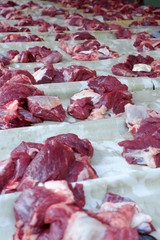 Fresh red beef is cut into small pieces to celebrate the Muslim holiday, Eid al-Adha