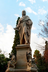 Fototapeta na wymiar The marble statue of Ioannis Varvakis. Its located in the garden of the Zappeion Palace of Athens, Greece