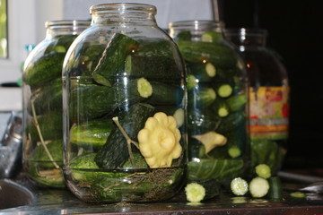 pickled cucumbers in transparent jars-preparations for the winter