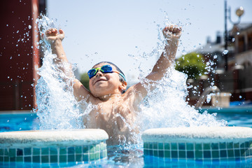 child playing and having fun in the pool
