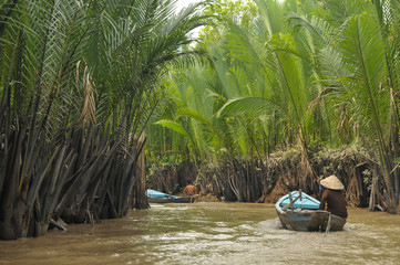 Boat Riding over Ben Tre River, Mekong Delta. - obrazy, fototapety, plakaty