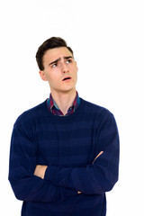 Obraz premium Studio shot of young handsome Caucasian man thinking isolated against white background