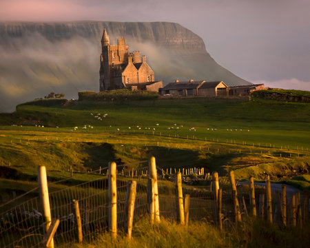 The fairytale castle, Classiebawn Castle, perched on top of a hill in the Irish landscape looking out to the Atlantic ocean.