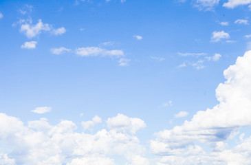 A large group of white clouds floating in the sky with copy space for text
