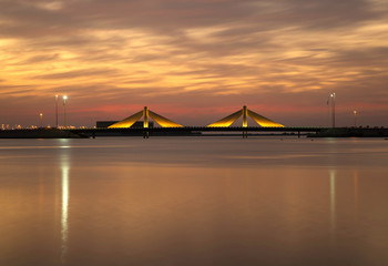 Fototapeta na wymiar Sheikh Salman Causeway bridge during sunet with dramatic sky, Bahrain