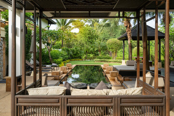 Exterior design of house, home and villa feature swimming pool, sofa cushion, daybed, pavilion and garden