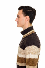 Profile view of young handsome Caucasian man isolated against white background