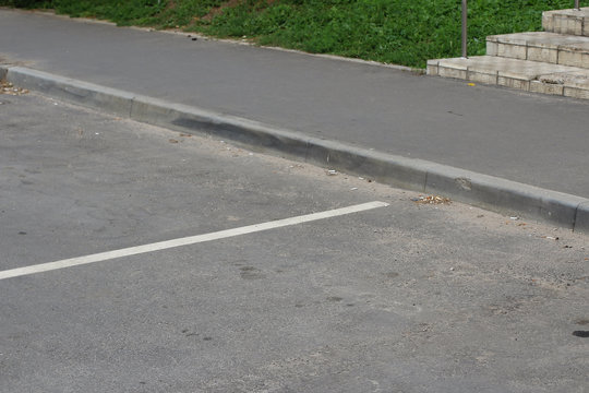 Curb on the street asphalt road.