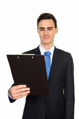 Portrait of happy young handsome businessman in suit
