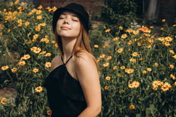 A teenage girl is having a walk in a green city park