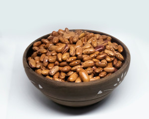Red beans in wooden bowl on white background