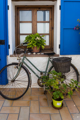 Fototapeta na wymiar House with bicycle at the door in a Mediterranean village near Barcelona. Montgat