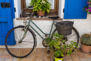 Fototapeta na wymiar House with bicycle at the door in a Mediterranean village near Barcelona. Montgat