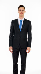 Studio shot of young handsome Caucasian businessman isolated against white background