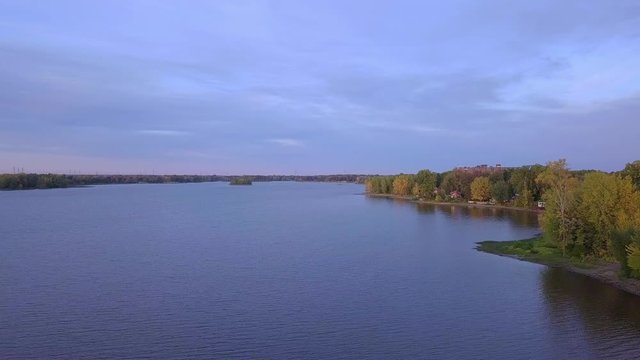 Aerial still shot over the Thousand Islans river at sundown