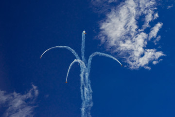 Inversion trail of the plane. A small plane practices aerobatics