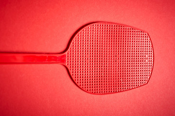 red isolated plastic fly trap on intense colored background