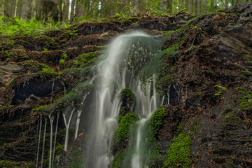 Fototapeta premium Waterfall near Kouty nad Desnou village in summer day