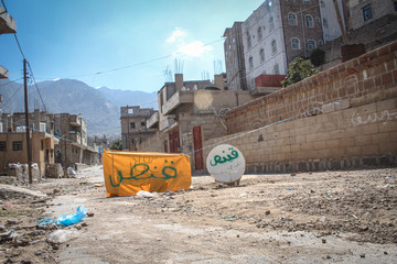 warning panels written on it ( sniper ) warning civilians against a Houthi militia sniper in the...