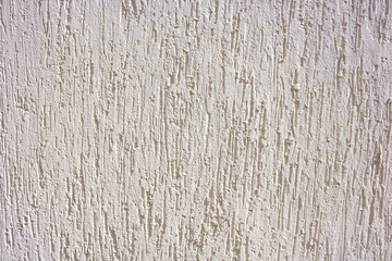 White with decorative relief . White stucco wall. The white background of the walls
