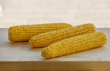 Close up group of corns on wooden table.
