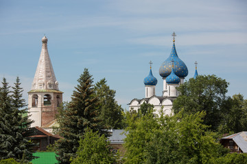 The ancient town of Suzdal. View on the blue domes with stars of the Kremlin. Gold ring of Russia. Vladimir region.