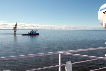 Arctic navigation in summer. Service ships at sea.
