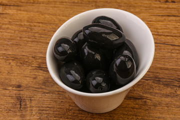 Pickled black olives in the bowl