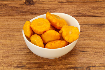 Marinated yellow patisson in the bowl