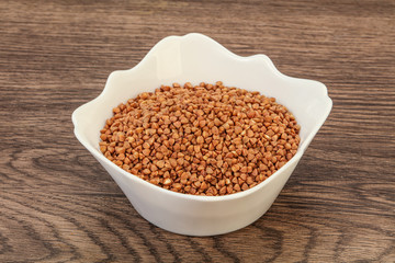 Raw buсkwheat cereal in the bowl