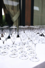 Drink glasses on wedding table in restaurant. Set of drink glasses. Wine glasses 