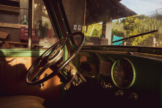 Classic Willys old car green speedometer  and steering wheel closeup. Vintage concept.
