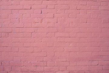 The texture of the brick wall is painted pink. background
