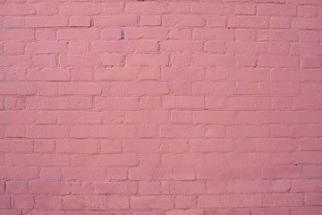 The texture of the brick wall is painted pink. background