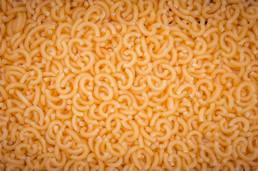 Background of raw macaroni, top view. Food background