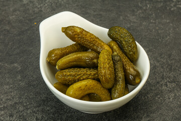 Pickled gherkin in the bowl