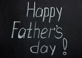 
Happy father's day greeting lettering on chalk board
