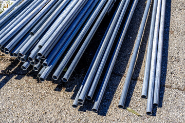 Obraz premium Metal steel pipe or Aluminum and chrome stainless pipes in stack. Quality product 