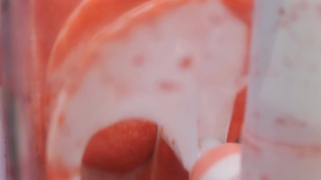 A close up view of a working slush machine.