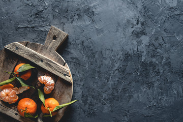Fresh orange mandarin on wooden cutting board. eco vegetarian. PNOV2019